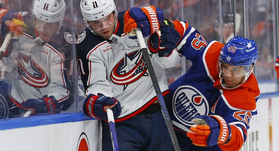 Edmonton Oilers' Darnell Nurse checks Columbus Blue Jackets' Adam Fantilli during the second period at Rogers Place.