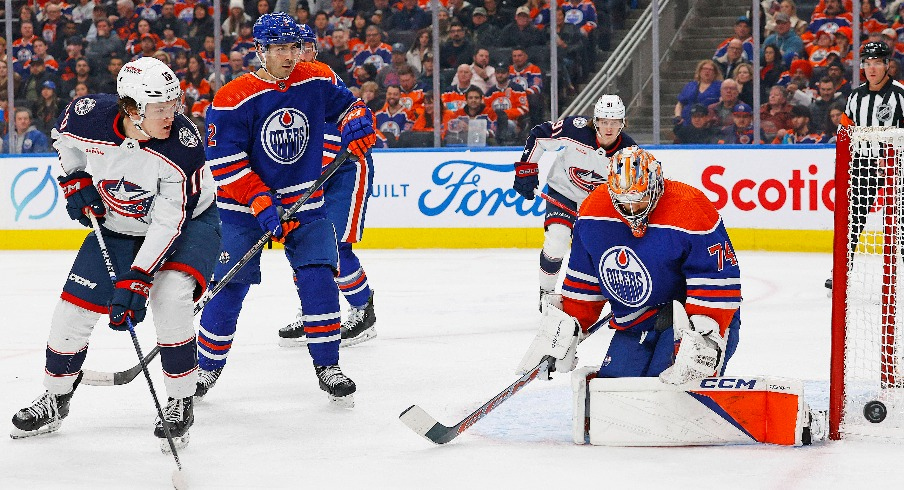 Edmonton Oilers goaltender Stuart Skinner (74) makes a save on a deflection by Columbus Blue Jackets forward Dmitri Voronkov (10) during the second period at Rogers Place.