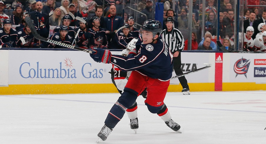 Columbus Blue Jackets defenseman Zach Werenski (8) follows though on a shot against the Ottawa Senators during the second period at Nationwide Arena.