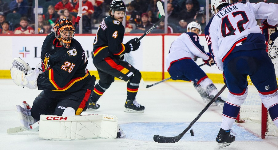 Columbus Blue Jackets center Alexandre Texier (42) scores a goal against Calgary Flames goaltender Jacob Markstrom (25) during the second period at Scotiabank Saddledome.