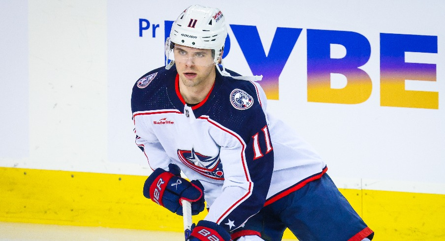 Columbus Blue Jackets center Adam Fantilli (11) skates during the warmup period against the Calgary Flames at Scotiabank Saddledome.