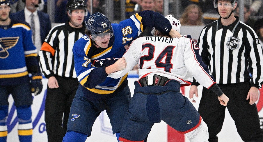 Columbus Blue Jackets right wing Mathieu Olivier (24) fights St. Louis Blues defenseman Tyler Tucker (75) during the second period at Enterprise Center.