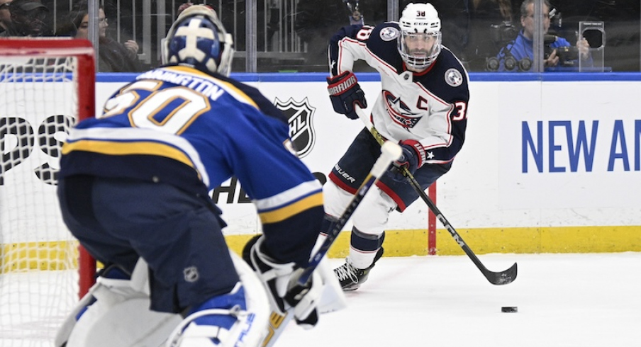 Columbus Blue Jackets' Boone Jenner skates against the St. Louis Blues during the third period at Enterprise Center.