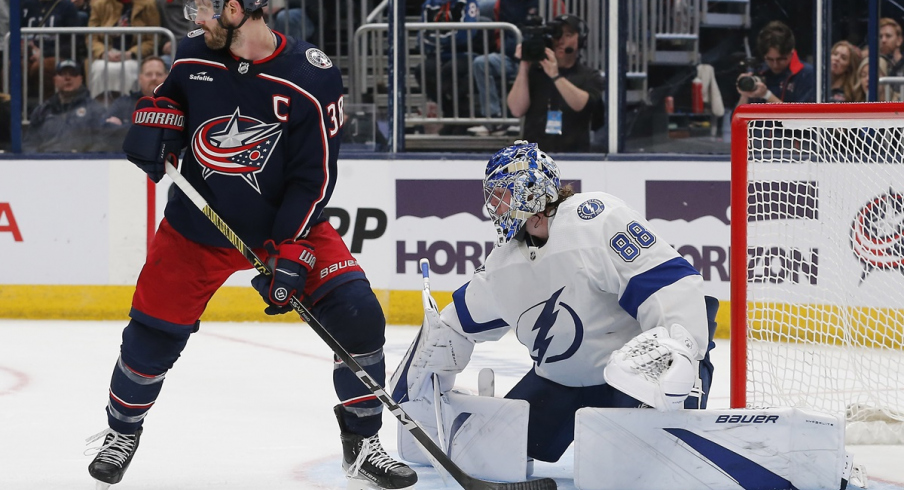 Boone Jenner looks tip a shot against the Tampa Bay Lightning 