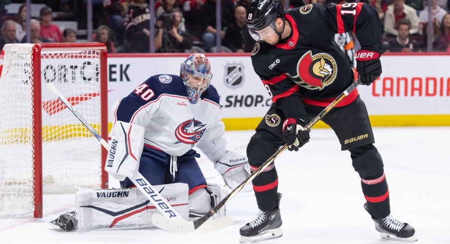 Ottawa Senators right wing Drake Batherson handles the puck in front of Columbus Blue Jackets goalie Daniil Tarasov