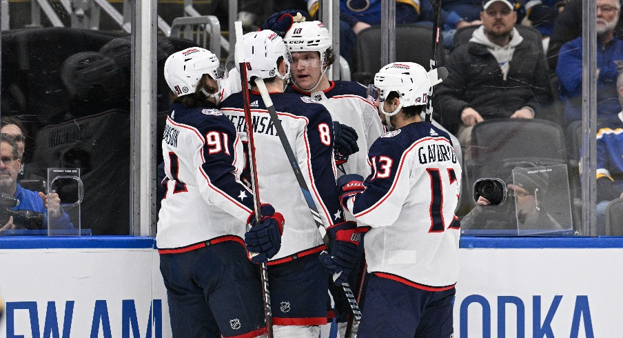 Columbus Blue Jackets left wing Dmitri Voronkov (10) is congratulated by teammates after scoring a goal against the St. Louis Blues during the third period at Enterprise Center.