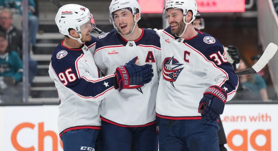 Columbus Blue Jackets' Zach Werenski celebrates with Jack Roslovic and Boone Jenner after scoring a goal against the San Jose Sharks during the first period at SAP Center at San Jose.