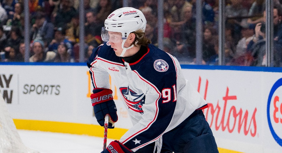 Columbus Blue Jackets forward Kent Johnson (91) handles the puck against the Vancouver Canucks in the first period at Rogers Arena.