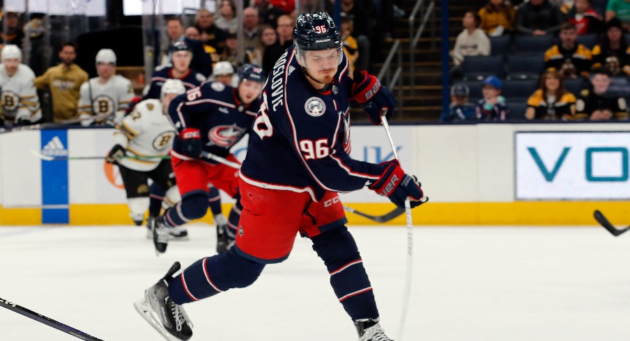 Columbus Blue Jackets center Jack Roslovic (96) wrists a shot on goal against the Boston Bruins during the third period at Nationwide Arena.