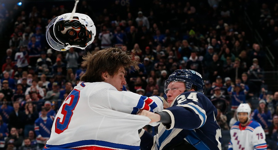 Columbus Blue Jackets right wing Mathieu Olivier (24) and New York Rangers center Matt Rempe (73) fight during the first period at Nationwide Arena.