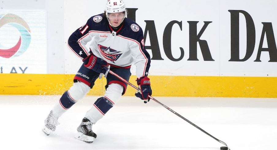 Columbus Blue Jackets' Kent Johnson skates with the puck against the San Jose Sharks during the third period at SAP Center at San Jose.