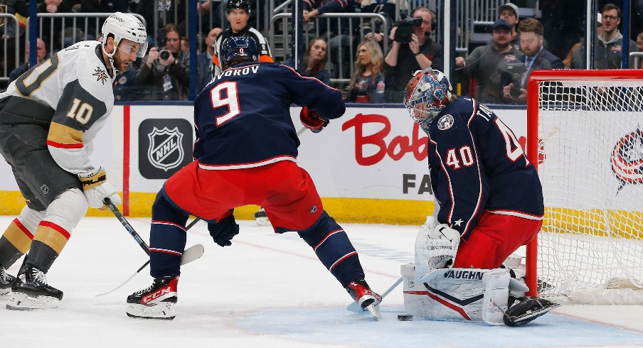 Columbus Blue Jackets goalie Daniil Tarasov (40) makes a pad save as Vegas Golden Knights center Nicolas Roy (10) looks for a rebound during the first period at Nationwide Arena. 