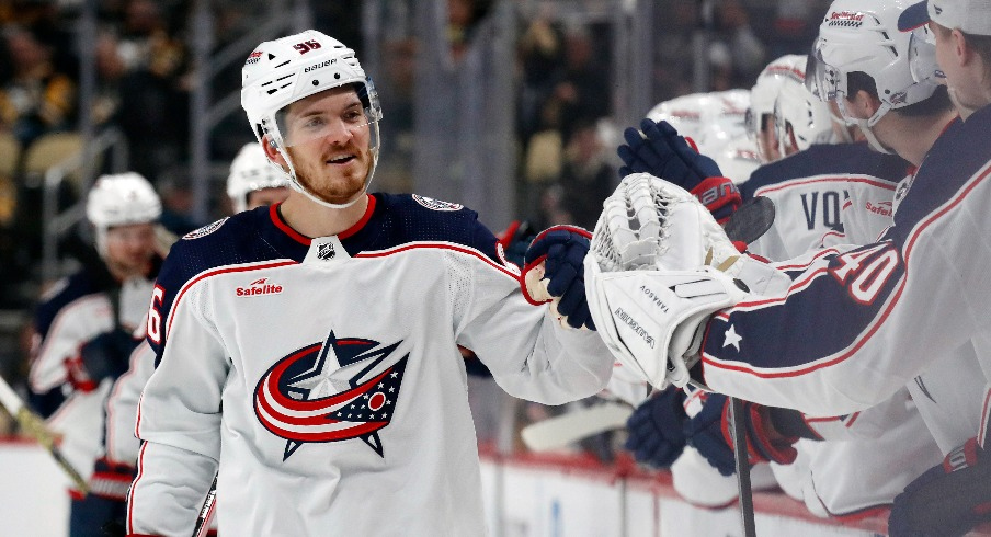 Columbus Blue Jackets center Jack Roslovic (96) celebrates with the Blue Jackets bench after scoring a goal against the Pittsburgh Penguins during the third period at PPG Paints Arena. The Penguins won 5-3.