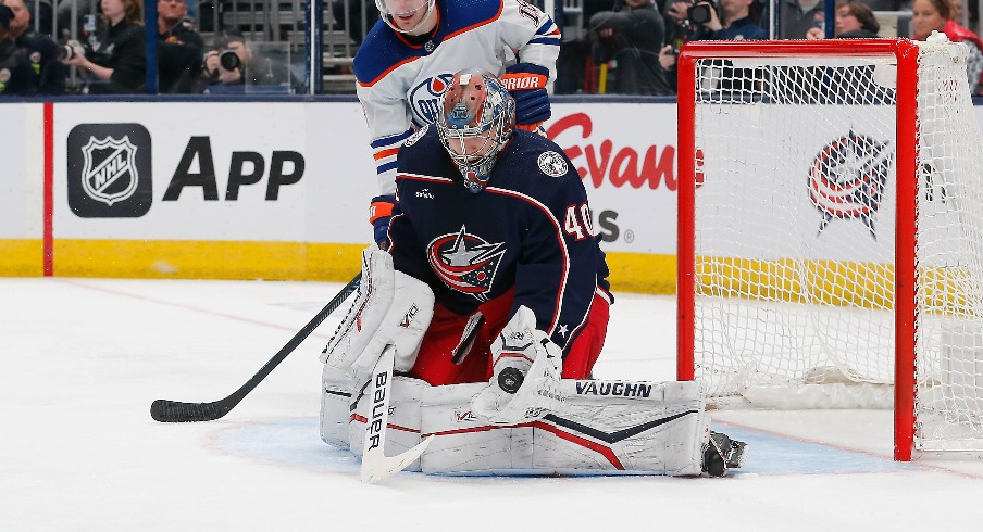 Columbus Blue Jackets goalie Daniil Tarasov (40) makes a glove save as Edmonton Oilers center Zach Hyman (18) looks for a rebound during the third period at Nationwide Arena.