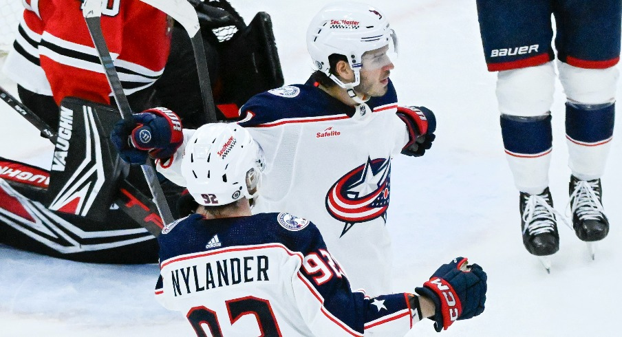 Columbus Blue Jackets center Cole Sillinger (4) celebrates with Columbus Blue Jackets left wing Alexander Nylander (92) after scoring against the Chicago Blackhawks during the second period at the United Center.