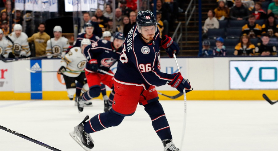 Columbus Blue Jackets center Jack Roslovic (96) wrists a shot on goal against the Boston Bruins during the third period at Nationwide Arena.