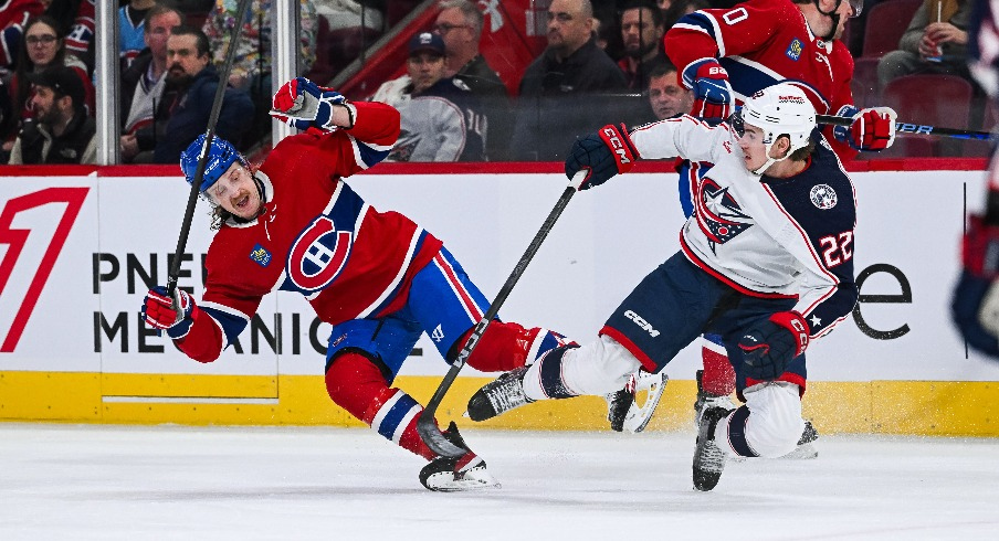 Montreal Canadiens left wing Michael Pezzetta (55) and Columbus Blue Jackets defenseman Jake Bean (22) collide with each other and fall on the ice during the first period at Bell Centre.