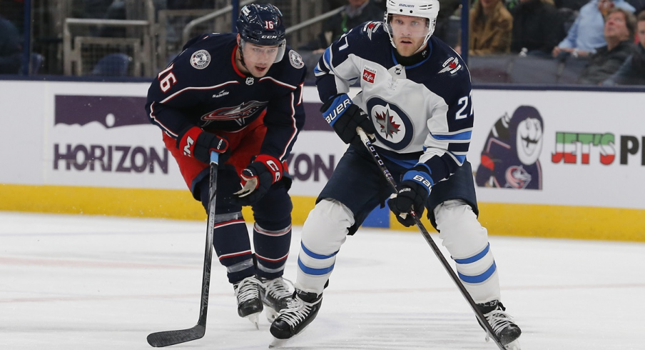 Winnipeg Jets left wing Nikolaj Ehlers carries the puck in front of Brendan Gaunce