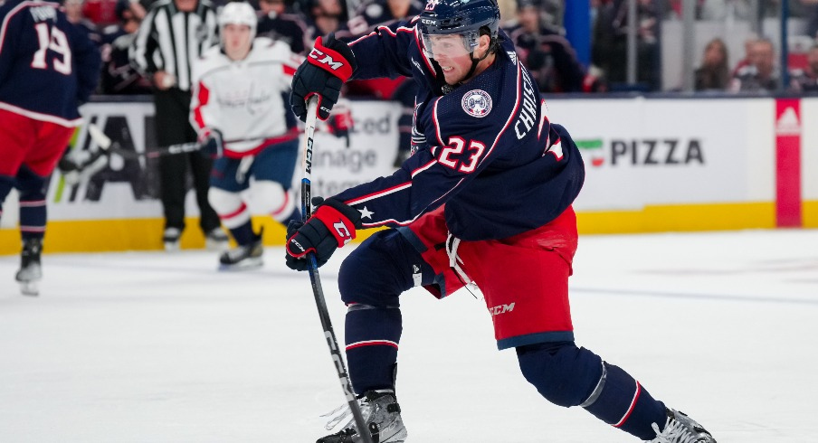 Columbus Blue Jackets defenseman Jake Christiansen (23) shoots the puck against the Washington Capitals in the second period at Nationwide Arena.