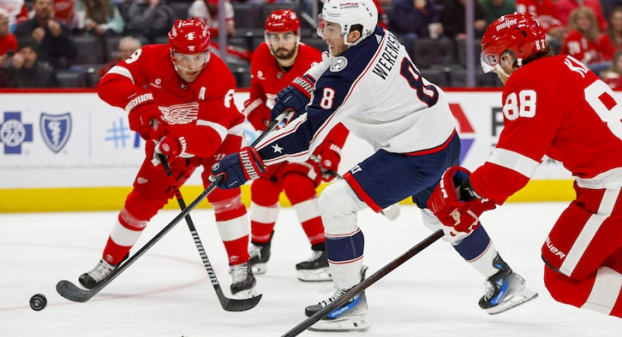 Columbus Blue Jackets' Zach Werenski shoots the puck during the first period of the game against the Detroit Red Wings at Little Caesars Arena.