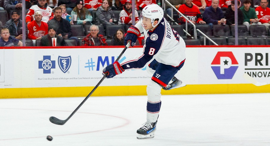 Columbus Blue Jackets defenseman Zach Werenski (8) handles the puck during the first period of the game against the Detroit Red Wings at Little Caesars Arena.