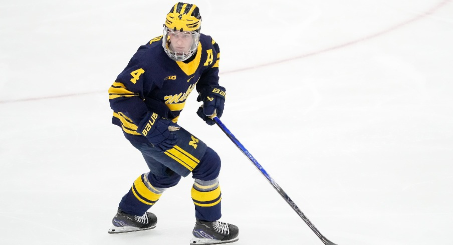Michigan Wolverines forward Gavin Brindley (4) skates against the Ohio State Buckeyes during the NCAA men s hockey game at Value City Arena.