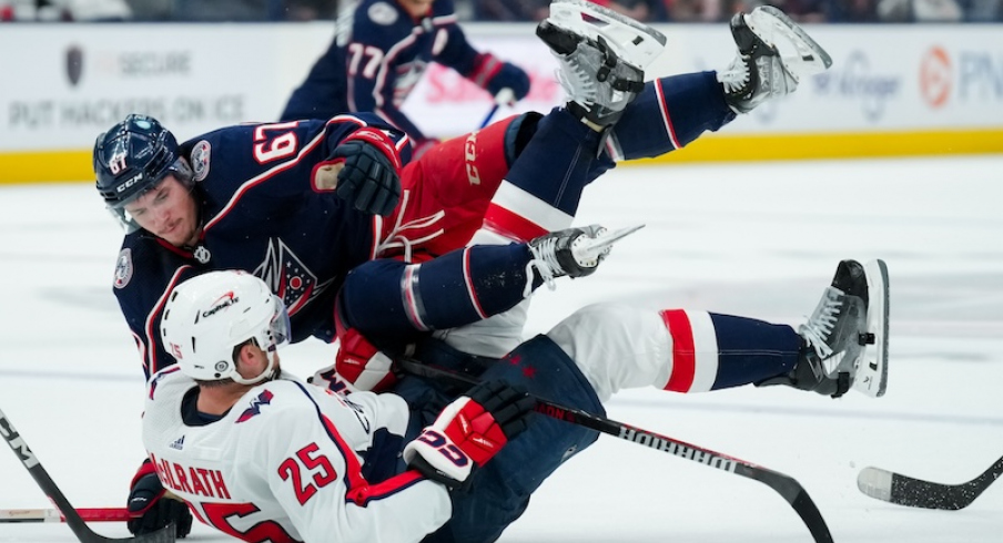 Columbus Blue Jackets' James Malatesta checks Washington Capitals' Dylan McIlrath in the second period at Nationwide Arena.