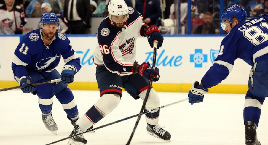 Columbus Blue Jackets' Kirill Marchenko scores a goal as Tampa Bay Lightning's Erik Cernak and Luke Glendening attempted to defend during the second period at Amalie Arena.