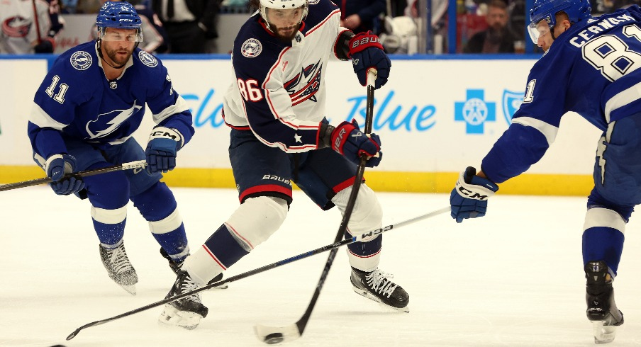 Columbus Blue Jackets right wing Kirill Marchenko (86) scores a goal as Tampa Bay Lightning defenseman Erik Cernak (81) and center Luke Glendening (11) attempted to defend during the second period at Amalie Arena.