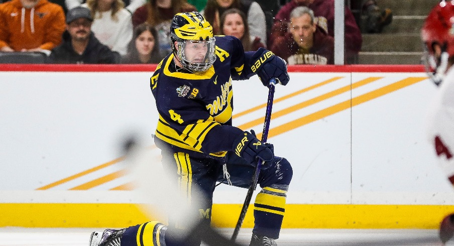 Michigan forward Gavin Brindley (4) shoots the puck against Boston College during the third period of the Frozen Four semifinal game at Xcel Energy Center in St. Paul, Minn. on Thursday, April 11, 2024.