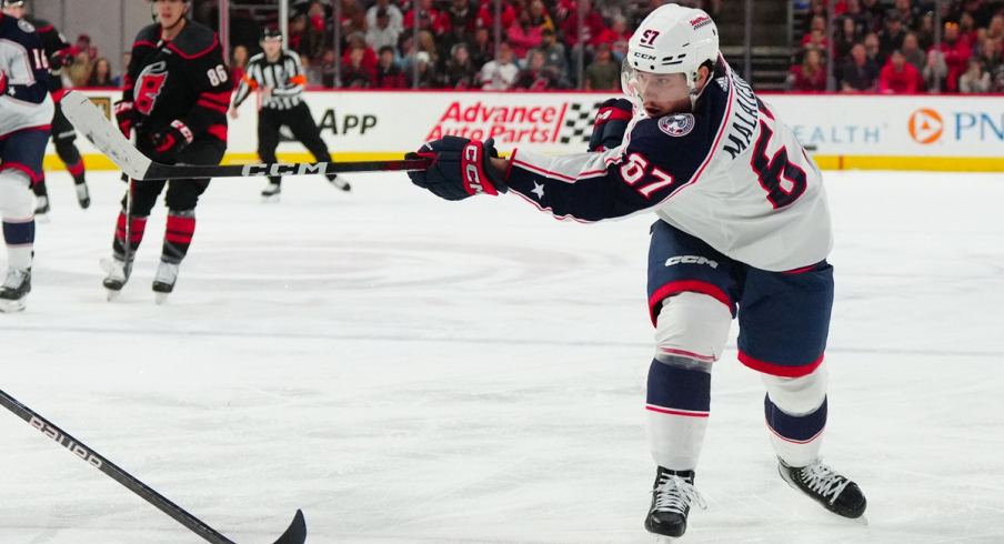 Columbus Blue Jackets left wing James Malatesta takes a shot against the Carolina Hurricanes