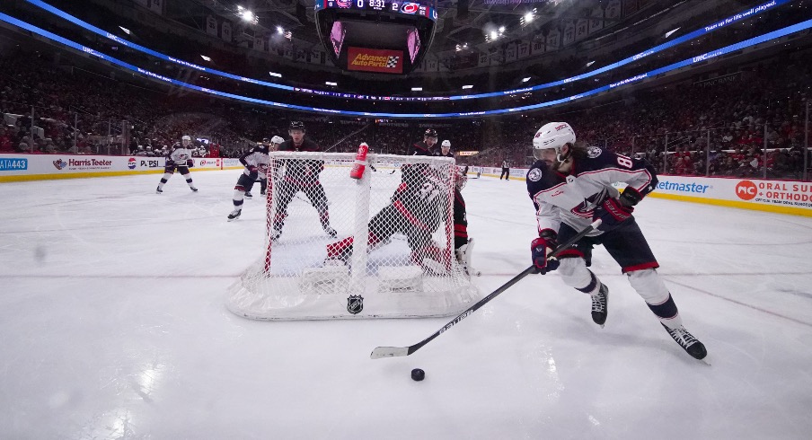 Columbus Blue Jackets right wing Kirill Marchenko (86) skates with the puck behind the net against the Carolina Hurricanes during the second period at PNC Arena.