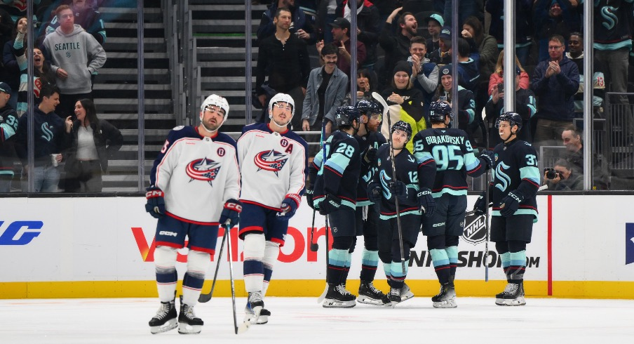 The Seattle Kraken celebrate after a goal scored by left wing Tye Kartye (12) during the second period against the Columbus Blue Jackets at Climate Pledge Arena.