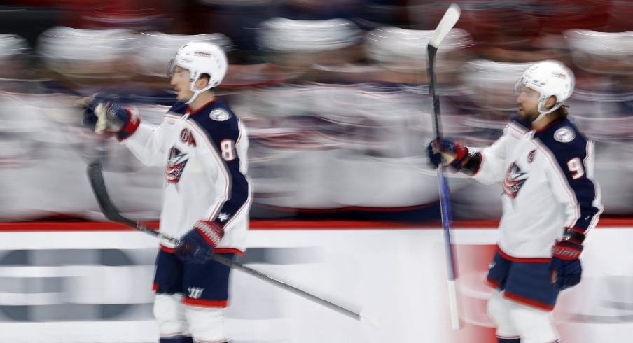 Columbus Blue Jackets defenseman Zach Werenski (8) celebrates after scoring a goal against the Washington Capitals in the first period at Capital One Arena.