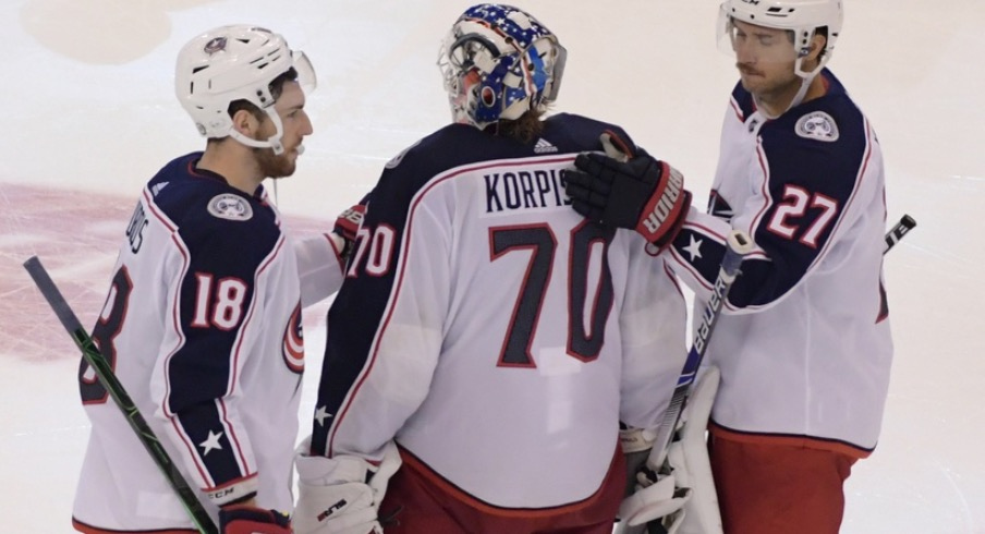 Columbus Blue Jackets goalie Joonas Korpisalo (70) is consoled by teammates after a 3-2 loss to Tampa Bay Lightning in the fifth overtime period in game one of the first round of the 2020 Stanley Cup Playoffs at Scotiabank Arena.