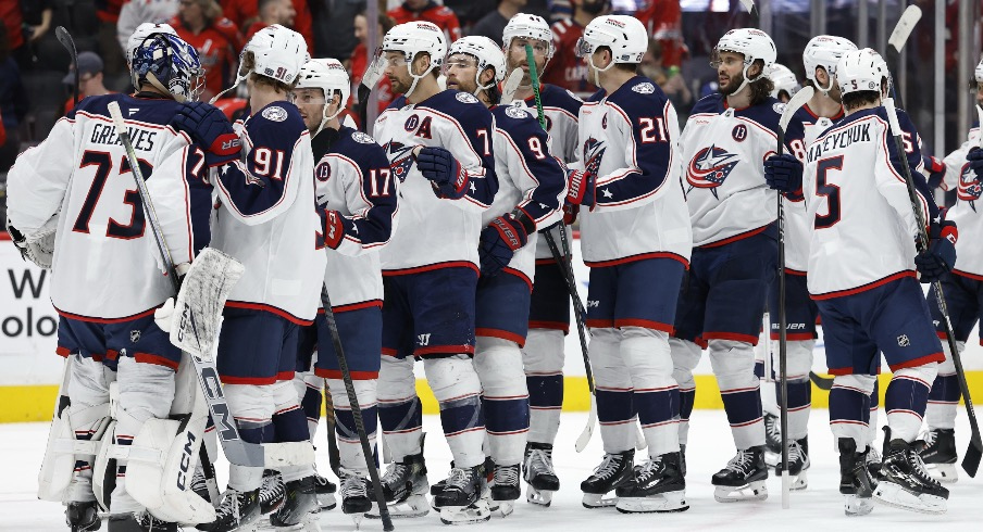 Columbus Blue Jackets goaltender Jet Greaves (73) celebrates with teammates after their game against the Washington Capitals at Capital One Arena.