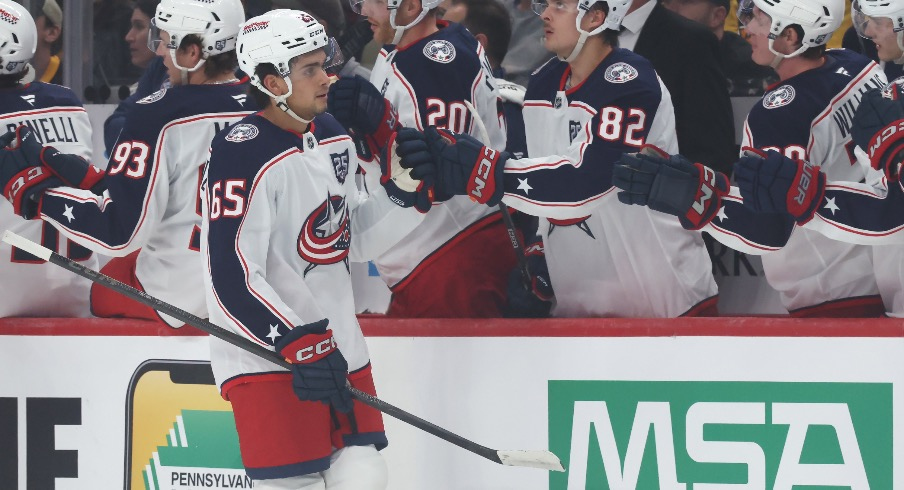 Columbus Blue Jackets center Luca Del Bel Belluz (65) celebrates his goal with the Blue Jackets bench against the Pittsburgh Penguins during the first period at PPG Paints Arena.