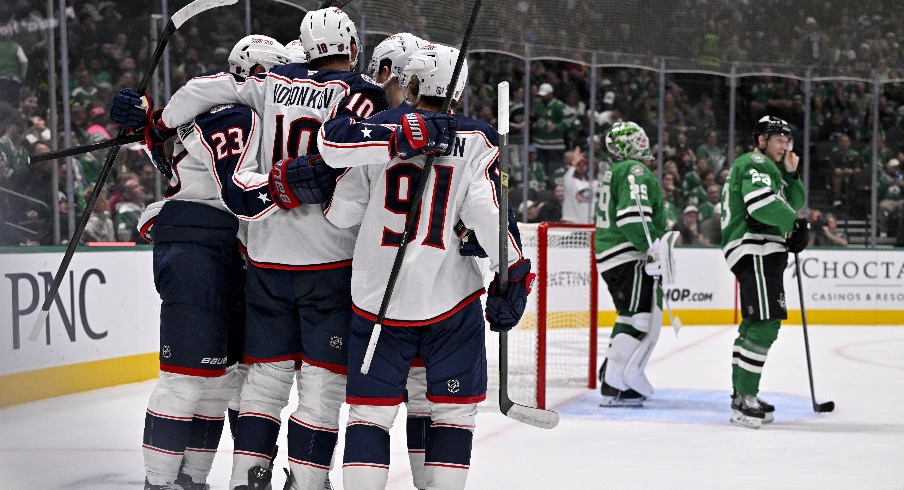 Oct 21, 2025; Dallas, Texas, USA; Columbus Blue Jackets left wing Dmitri Voronkov (10) celebrates with his teammates after scoring a power play goal against the Dallas Stars as goaltender Jake Oettinger (29) and defenseman Esa Lindell (23) look on during the third period at the American Airlines Center.