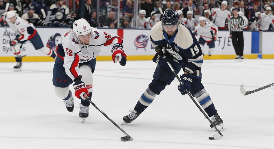 Oct 24, 2025; Columbus, Ohio, USA; Columbus Blue Jackets center Adam Fantilli (19) carries the puck as Washington Capitals defenseman Martin Fehervary (42) defends during the second period at Nationwide Arena.