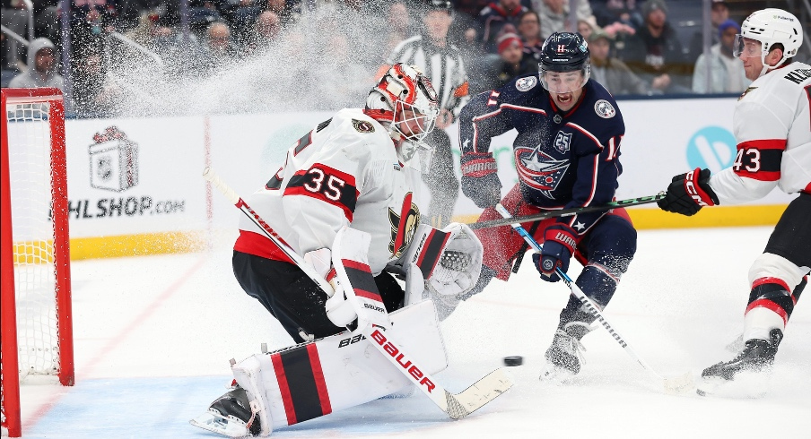Dec 11, 2025; Columbus, Ohio, USA; Ottawa Senators goaltender Linus Ullmark (35) saves the puck as Columbus Blue Jackets left wing Miles Wood (11) looks for a shot during the second period at Nationwide Arena.