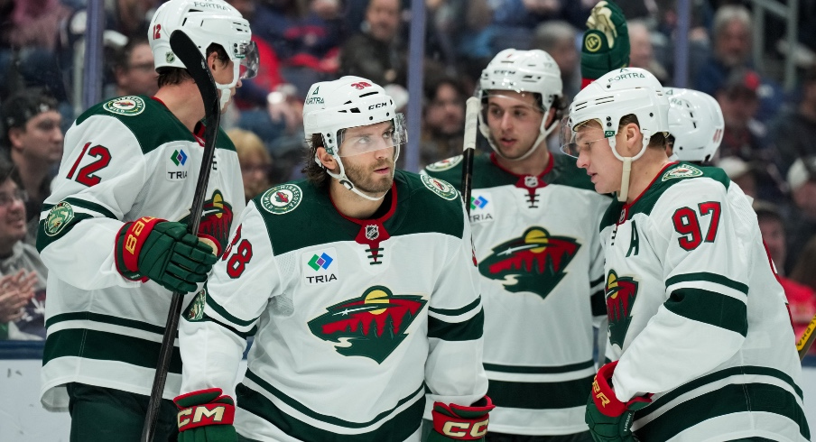 Dec 18, 2025; Columbus, Ohio, USA; Minnesota Wild right wing Ryan Hartman (38) celebrates with teammates after scoring a goal against Columbus Blue Jackets in the second period at Nationwide Arena.