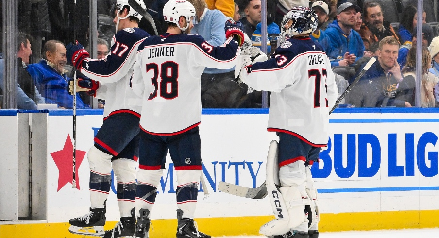 Jan 31, 2026; St. Louis, Missouri, USA; Columbus Blue Jackets goaltender Jet Greaves (73) and center Boone Jenner (38) celebrate after the Blue Jackets defeated the St. Louis Blues at Enterprise Center.
