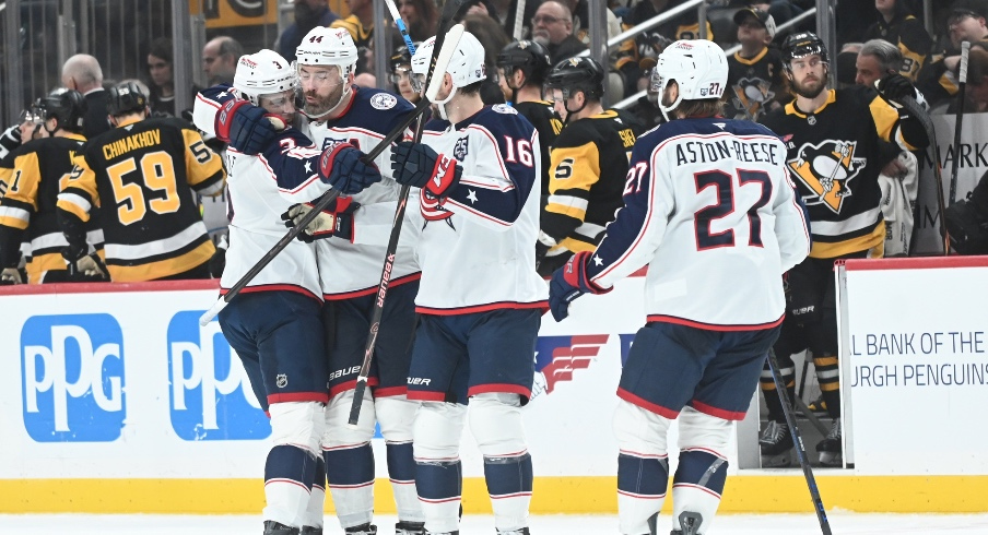 Jan 17, 2026; Pittsburgh, Pennsylvania, USA; Columbus Blue Jackets right wing Charlie Coyle (3) celebrates his shoot out goal with defenseman Erik Gudbranson (44) and Brendan Gaunce (16) and left wing Zach Aston-Reese after scoring on Pittsburgh Penguins goalie Arturs Silovs (37) in a shoot out at PPG Paints Arena. Columbus won 4-3.