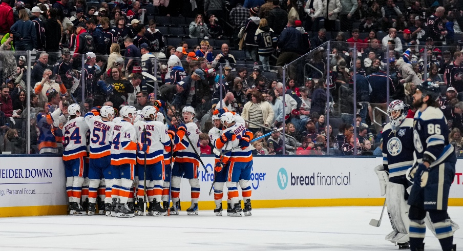 Feb 28, 2026; Columbus, Ohio, USA; New York Islanders right wing Simon Holmstrom (10) celebrates with teammates after scoring the game-winning goal against the Columbus Blue Jackets in the overtime period at Nationwide Arena.