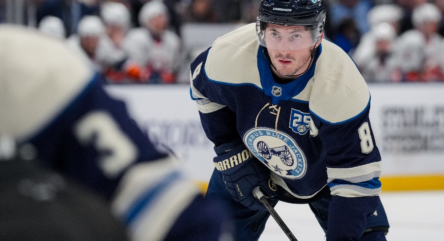 Feb 28, 2026; Columbus, Ohio, USA; Columbus Blue Jackets defenseman Zach Werenski (8) awaits the face-off against the New York Islanders in the second period at Nationwide Arena. Mandatory Credit: Aaron Doster-Imagn Images